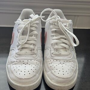 White Nike Dunk Low Sneakers with Pink Accents